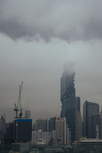 Buildings in city against sky