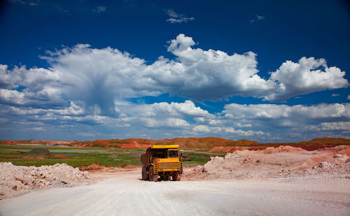 Scenic view of bauxite mine against sky
