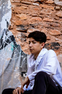 Thoughtful man sitting outdoors