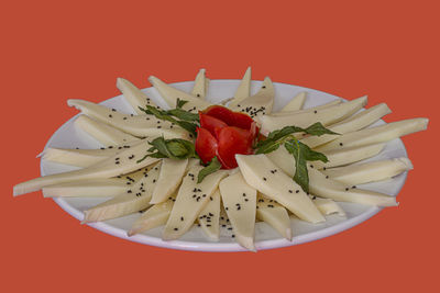 Close-up of red fruit in plate