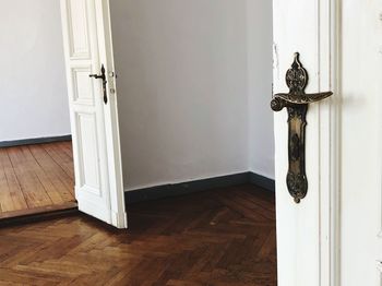 White door on hardwood floor at home