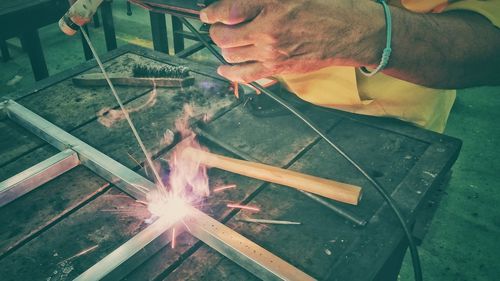 Low angle view of man working on fire