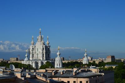 Buildings in city against sky 