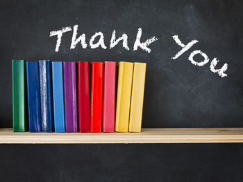 Close-up of multi colored text on table