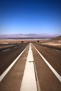 Empty road against clear sky