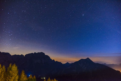 Clear and starry sky. night in the village of monte lussari. italy