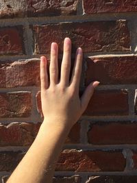 Close-up of hand on wall