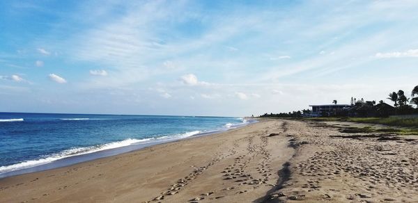 Scenic view of beach against sky