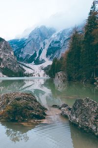 Scenic view of lake and mountains against sky