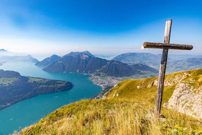 Scenic view of mountains against blue sky