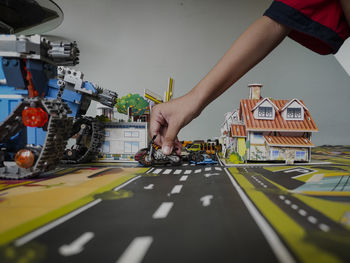 Cropped hands of man working at home