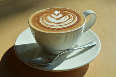 High angle view of coffee cup on table