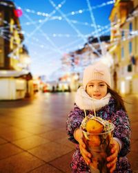 Portrait of a girl holding ice cream