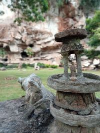 Close-up of rusty stack on rock