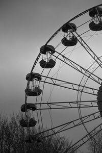 Low angle view of ferris wheel against sky