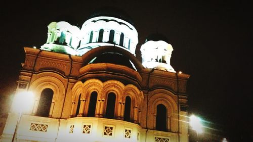 Low angle view of illuminated building at night