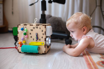 Portrait of cute baby boy with toy