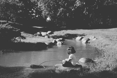 Girl playing at river