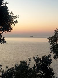 Scenic view of sea against sky at sunset