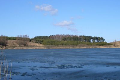 Scenic view of landscape against blue sky