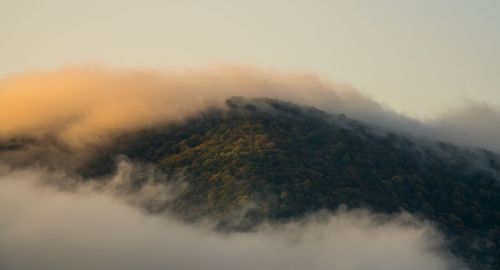 The fog on the mountain makes the landscape sublime and tranquil.