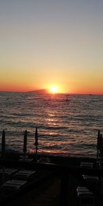 Scenic view of sea against clear sky during sunset