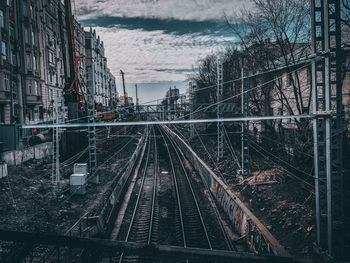 High angle view of railroad tracks amidst buildings in city