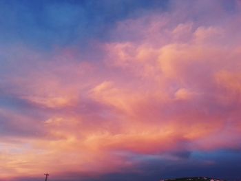 Low angle view of cloudy sky at sunset