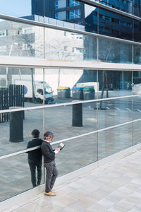 High angle view of man walking on street