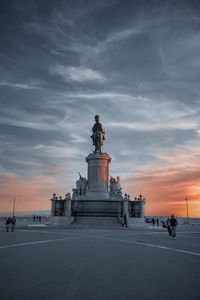 Statue of building at sunset