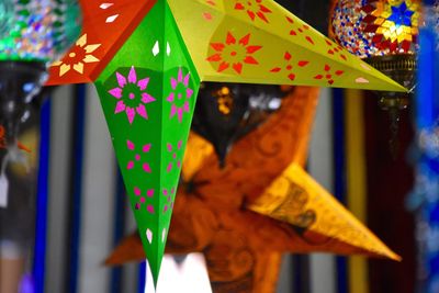 Close-up of star shape lanterns for sale in shop