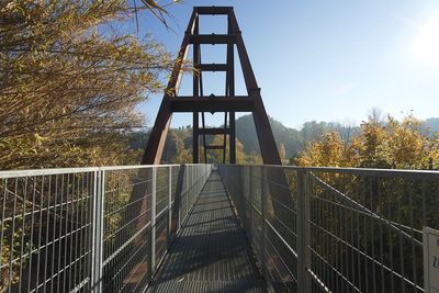 Railing on bridge against sky