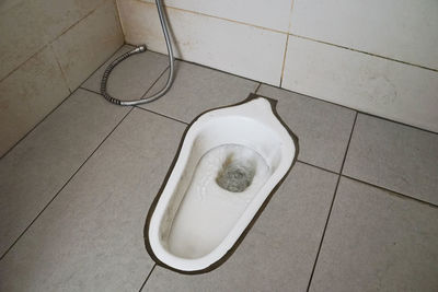 High angle view of bathroom on tiled floor at home