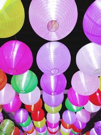 Low angle view of illuminated lanterns hanging on ceiling