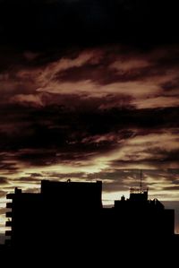 Silhouette of buildings at sunset