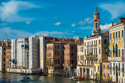 High angle view of venice city with gondola boat passing through the canals