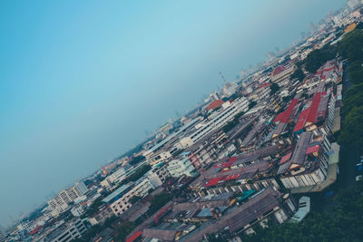 High angle view of buildings against clear sky