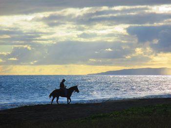 Scenic view of sea at sunset