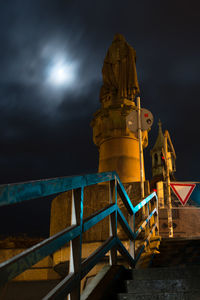 Low angle view of statue at night