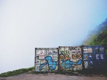 Graffiti on wall against clear sky