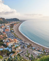 High angle view of beach and buildings against sky