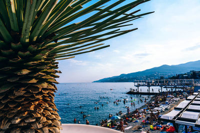 High angle view of people at beach against sky