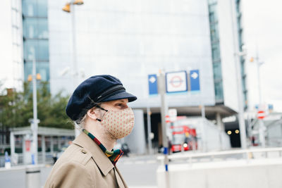 Portrait of man wearing a face mask man in city