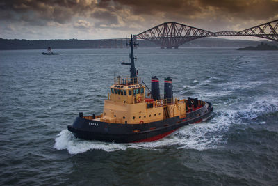 View of ship in sea against sky