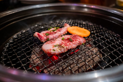 Close-up of food on barbecue