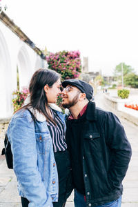 Young couple in love touching their noses during an excursion