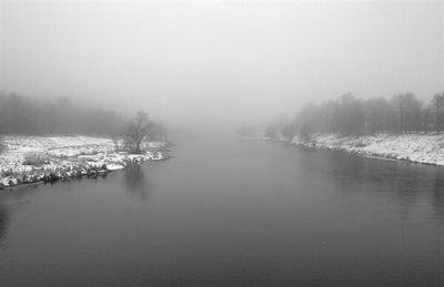 Scenic view of lake during foggy weather