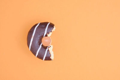 High angle view of ice cream against orange background