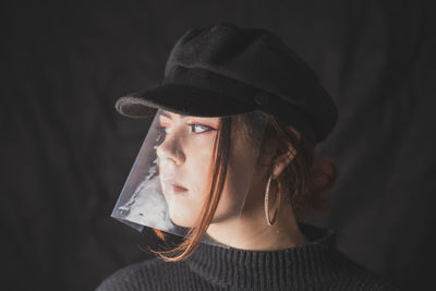 Young woman wearing hat