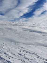 Scenic view of landscape against sky during winter